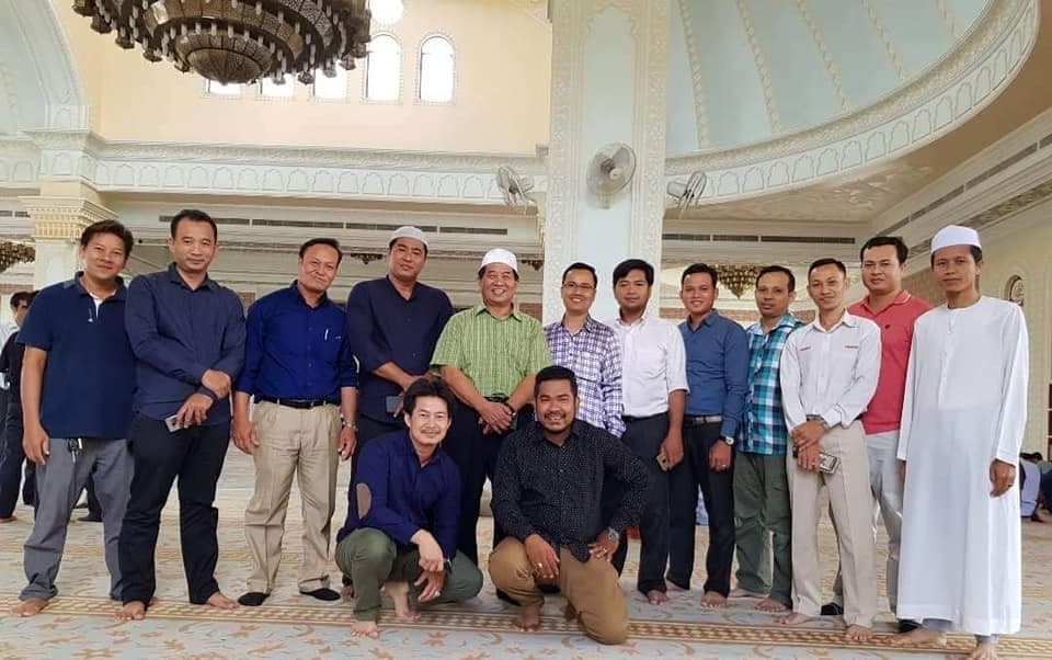 Ahmad Yahya with community members at the mosque